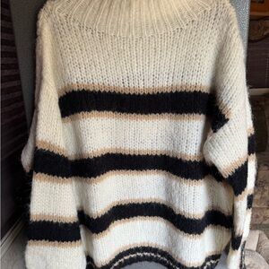 Elegant Black and Cream Striped Women's Turtleneck Sweater